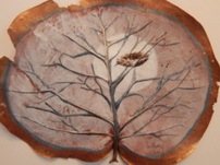 Winter Nest: A painting on a sea grape leaf depicting a leafless tree holding a nest